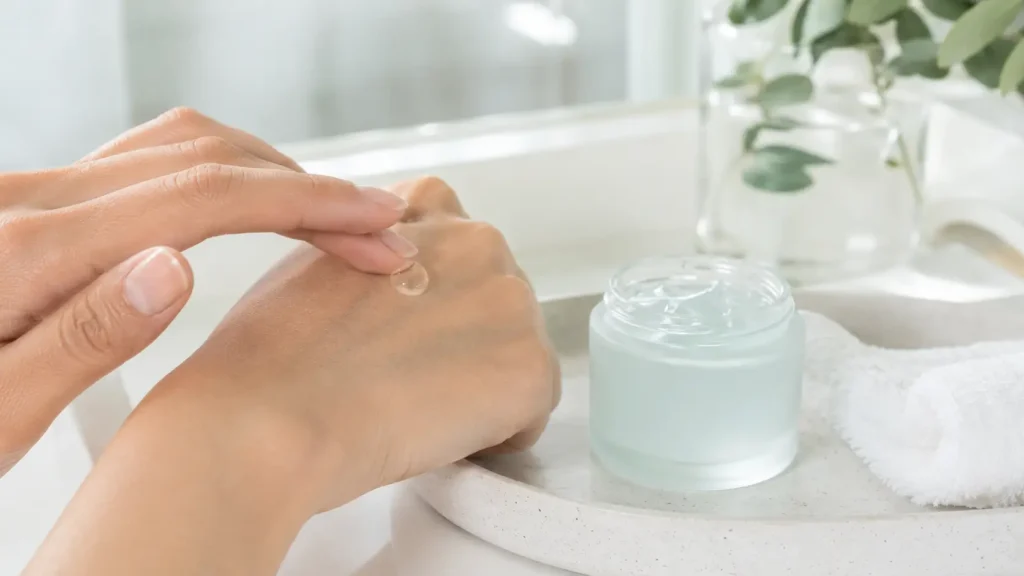 Applying gel moisturizer for oily skin